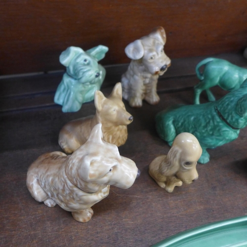 651 - A collection of eight Sylvac dogs and a calf