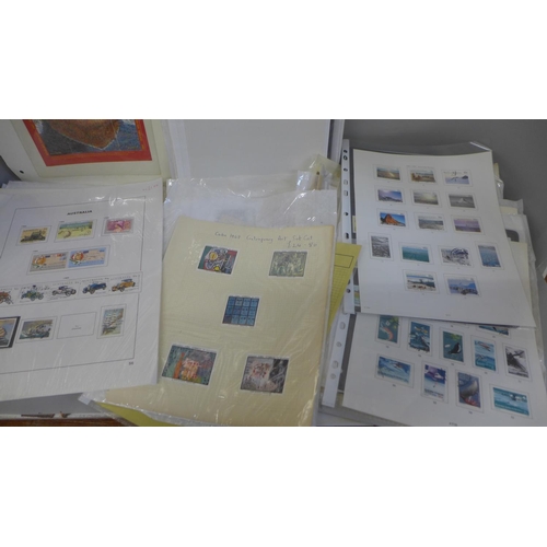 663 - Stamps; a box of stamps on album leaves