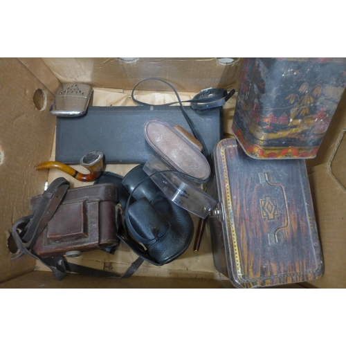 697 - A four piece carving set, cased, a two piece fish knife and fork set and tins and four cameras, etc.