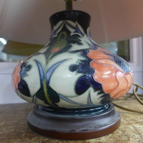 724 - A Moorcroft table lamp with shade