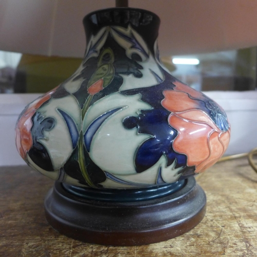 724 - A Moorcroft table lamp with shade