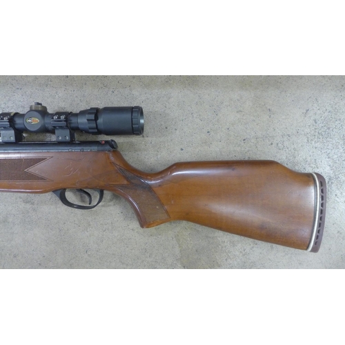 744 - An Edgar Bros. model 60's Quattro Trigger air rifle with scope, 0.22 calibre