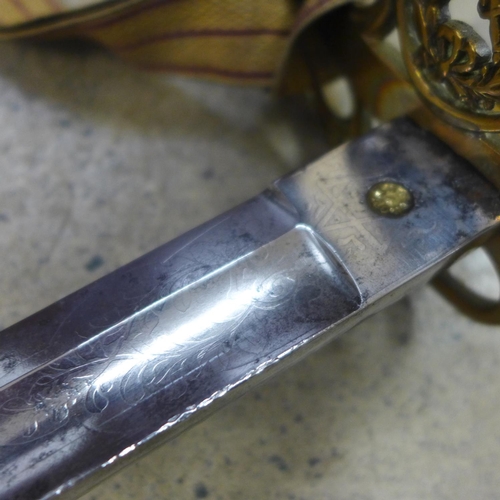 748 - A Victorian General Officer's sword, cross sword and baton, the blade marked Harman & Co., Calcutta