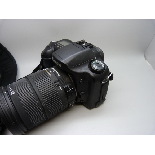 752 - A Canon D10 SLR digital camera with batteries, charger, etc., with Sigma 18:200mm lens