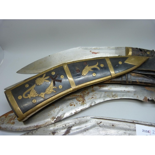 753 - Four Indian/Nepalese Kukri, one lacking scabbard