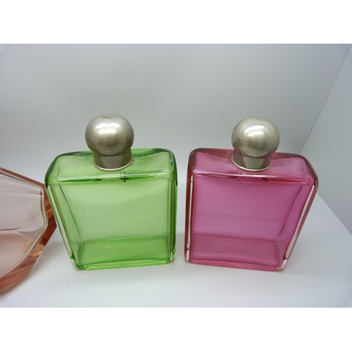 768 - A large Art Deco pink glass display bottle with original stopper, 23cm, and a green glass and a cran... 