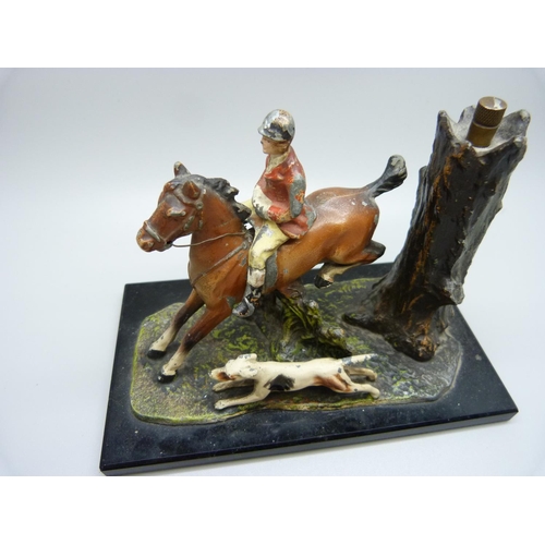 769 - A painted huntsman and hound table lighter, base 15cm