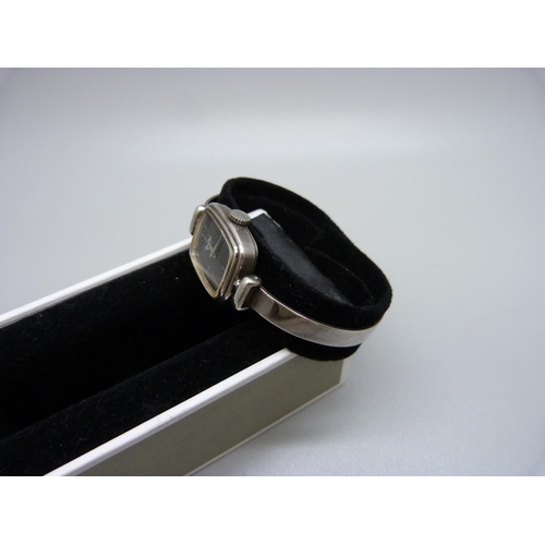 798 - A lady's silver Quilbe, Paris bangle wristwatch, circa 1978