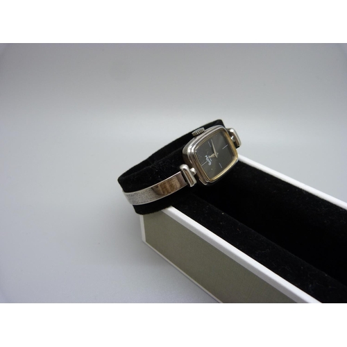 798 - A lady's silver Quilbe, Paris bangle wristwatch, circa 1978