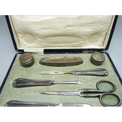 801 - A cased silver manicure set, Sheffield and Birmingham marks for 1918