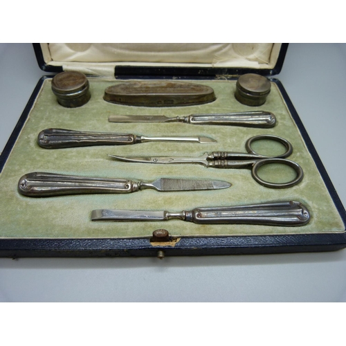 801 - A cased silver manicure set, Sheffield and Birmingham marks for 1918