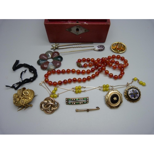 804 - A jewellery box containing Victorian/Edwardian items, mainly jewellery; an Art Nouveau pendant, a ca... 