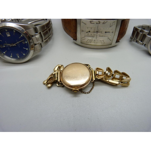 822 - A Guess designer wristwatch, Ben Sherman and Fishbone wristwatch and a lady's rolled gold wristwatch... 