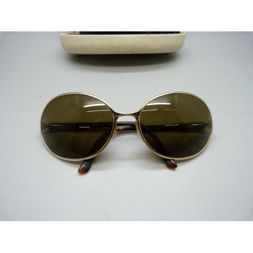 825 - A pair of lady's John Rocha sunglasses in original case