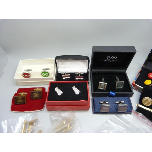 828 - A collection of cufflinks and tie pins