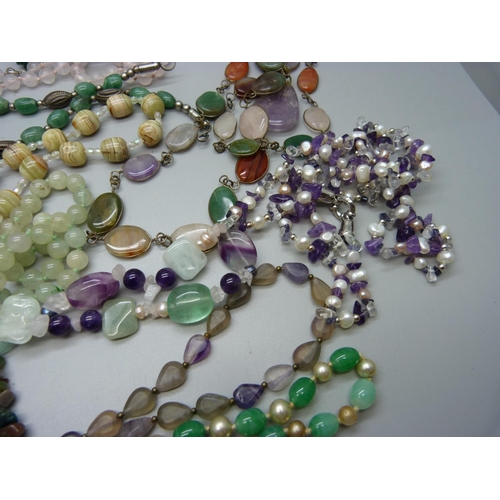 829 - A collection of bead necklaces including pearl, amethyst and jadeite