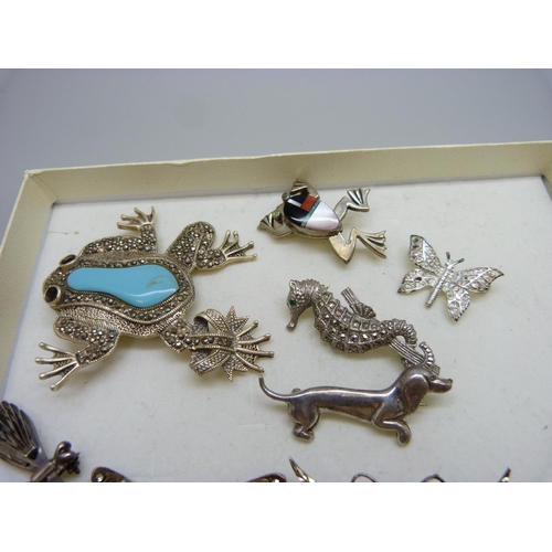 831 - A collection of eight silver animal brooches, some stones missing