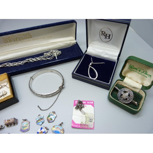 856 - Silver jewellery including a bangle and silver charms