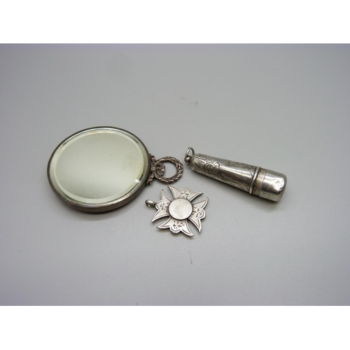 878 - A late Victorian silver mounted handbag mirror, a silver cheroot holder case and a silver fob