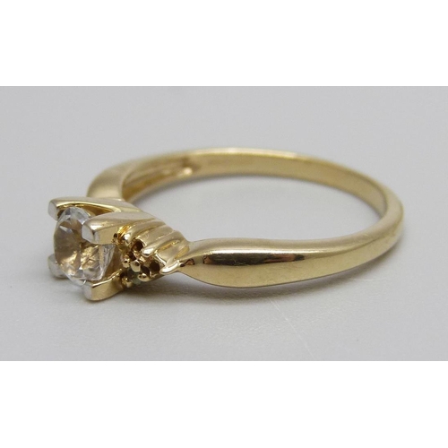 898 - A 9ct gold and white sapphire ring, missing small stones, 2.6g, N