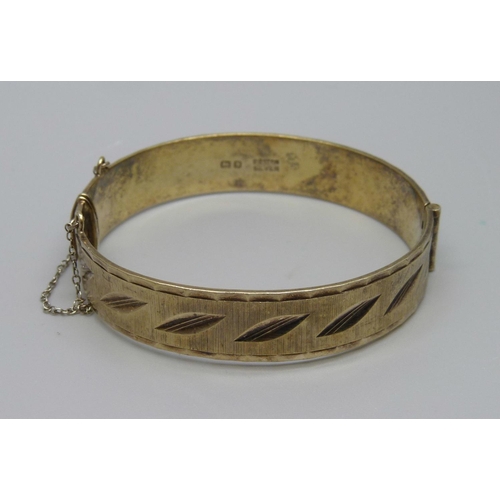 899 - A silver gilt bangle, London 1969, marked '22ct on silver', 28.8g, Fred Manshaw Ltd.