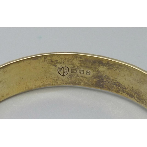 899 - A silver gilt bangle, London 1969, marked '22ct on silver', 28.8g, Fred Manshaw Ltd.