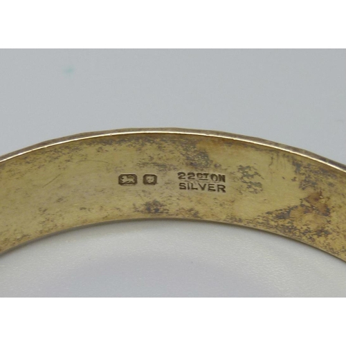 899 - A silver gilt bangle, London 1969, marked '22ct on silver', 28.8g, Fred Manshaw Ltd.