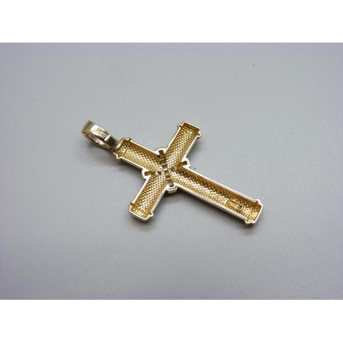 900 - A 9ct gold cross pendant set with diamonds, 6.2g, 29mm wide