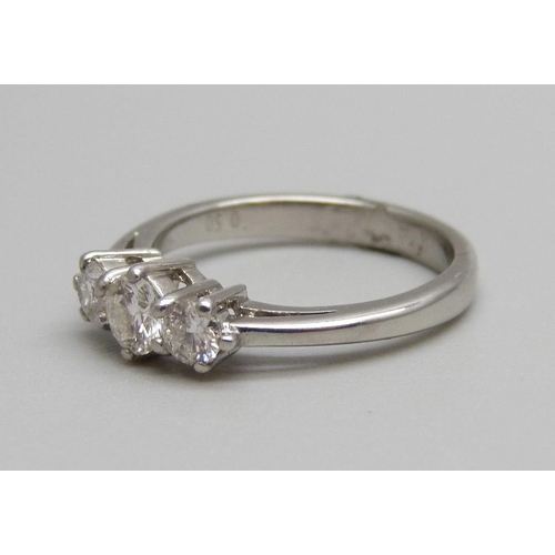 901 - A platinum and three stone diamond ring, 0.50ct diamond weight, 4.2g, K