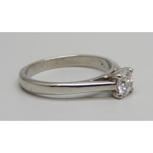 907 - A platinum set lab grown diamond solitaire ring, 0.5ct diamond weight, 4.6g, O, with certificate