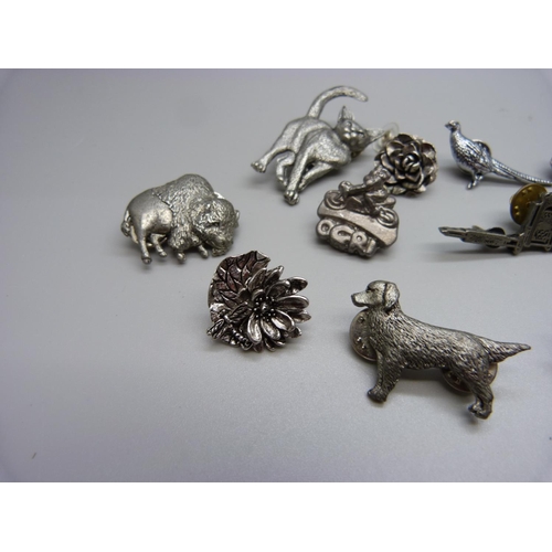 948 - Fourteen pewter brooches