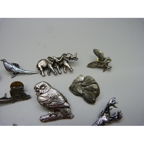 948 - Fourteen pewter brooches