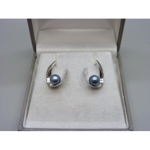 966 - A pair of 14ct white gold horseshoe shaped earrings with blue pearls, 3.2g