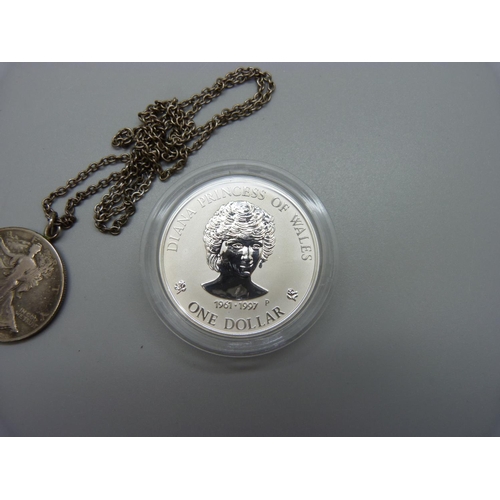 971 - A 1oz. fine silver 1997 coin and a half dollar pendant