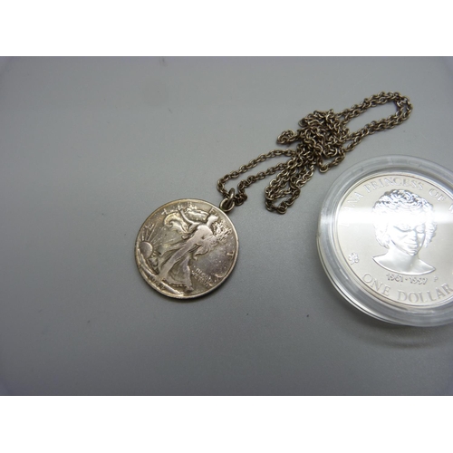 971 - A 1oz. fine silver 1997 coin and a half dollar pendant