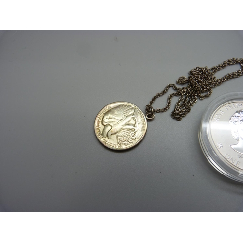 971 - A 1oz. fine silver 1997 coin and a half dollar pendant