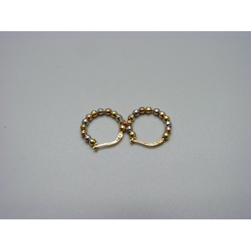 975 - A pair of 18ct gold earrings, 2.9g