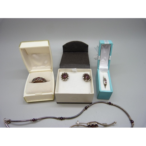 989 - A collection of silver stone set jewellery including a ruby set bracelet