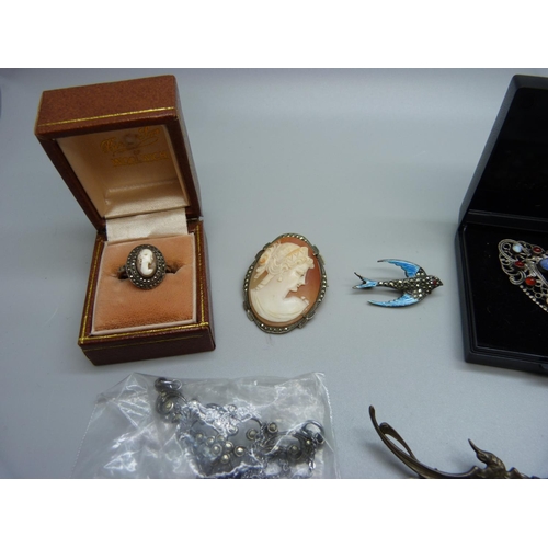 991 - Jewellery including an enamel and marcasite bird brooch, lacking one marcasite, a gem set brooch inc... 