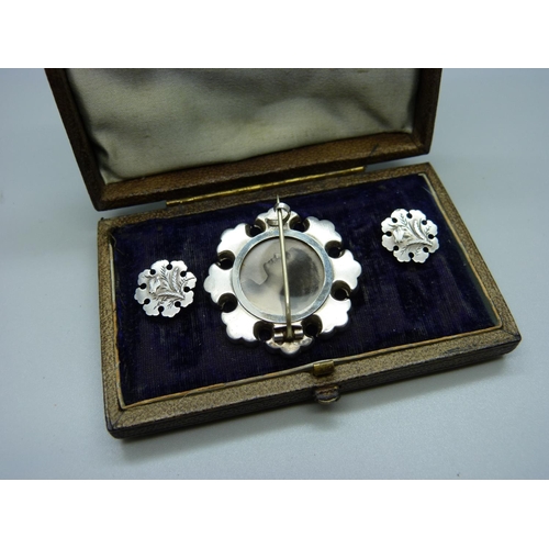 994 - A late Victorian brooch with photograph locket back and with matching earrings, in original Moroccan... 