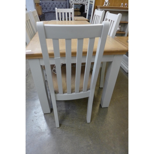 1332 - An extension dining table - 1.8-2.3m and six vertical slatted chairs  * This lot is subject to VAT