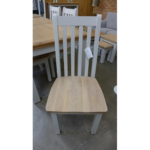 1332 - An extension dining table - 1.8-2.3m and six vertical slatted chairs  * This lot is subject to VAT