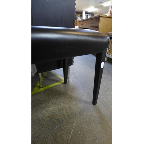 1530 - A black leather duet stool * this lot is subject to VAT