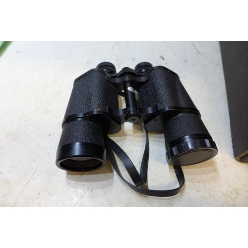 2257 - 4 pairs of binoculars and a Polaroid 315 camera