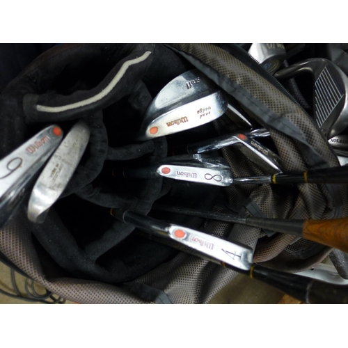 2325 - Four bags of golf clubs