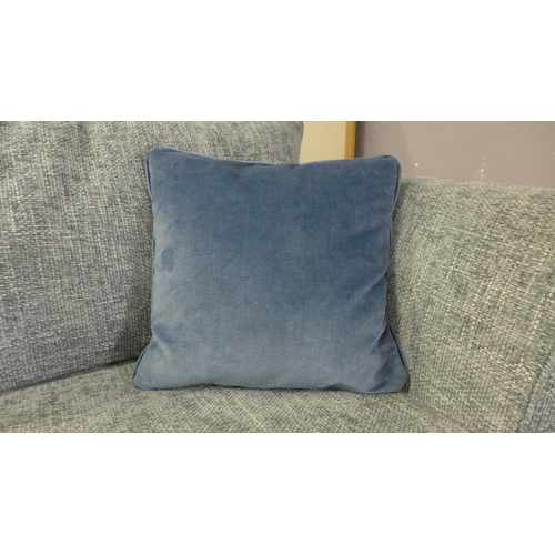 1396 - An aquamarine upholstered three seater sofa