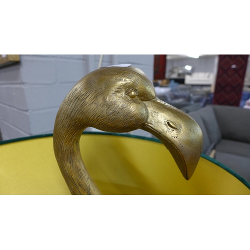 1406 - A gold floor standing flamingo lamp