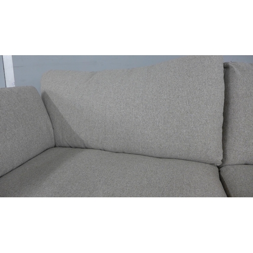 1442 - A light stone three seater sofa