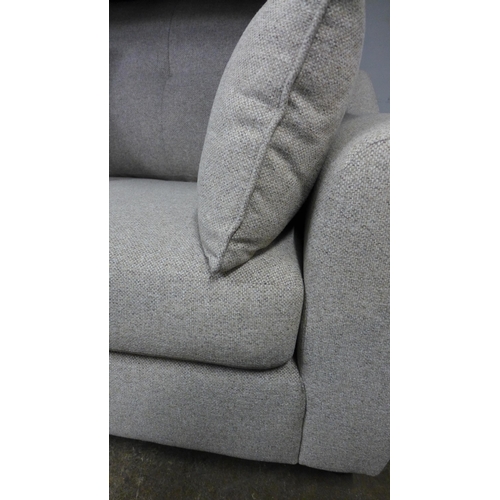 1443 - A light stone two seater sofa