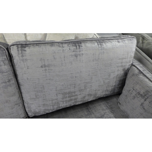 1448 - A charcoal velvet three seater sofa